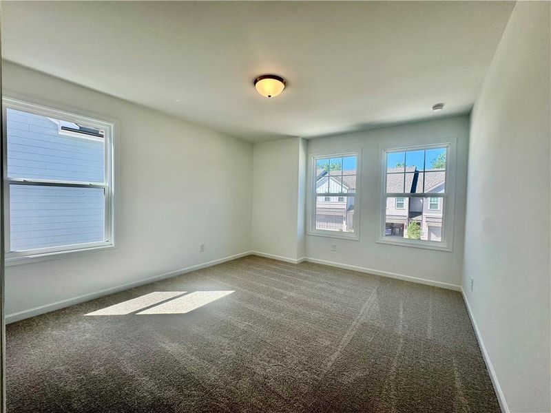Spacious, unfurnished interior of a new home in Eastlyn Crossing, Flowery Branch (Image 23).