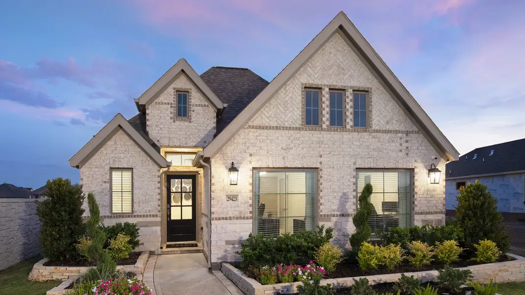Front exterior of a new home in Austin Point, Richmond, TX, highlighting curb appeal (Image 20). Front exterior of a new home in Austin Point, Richmond, TX, highlighting curb appeal (Image 20).