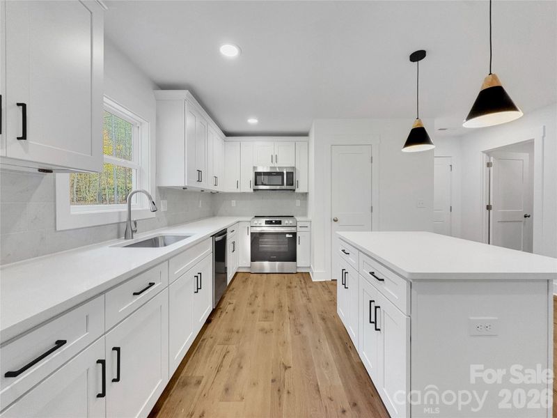 White soft close cabinets and beautiful quartz counters White soft close cabinets and beautiful quartz counters