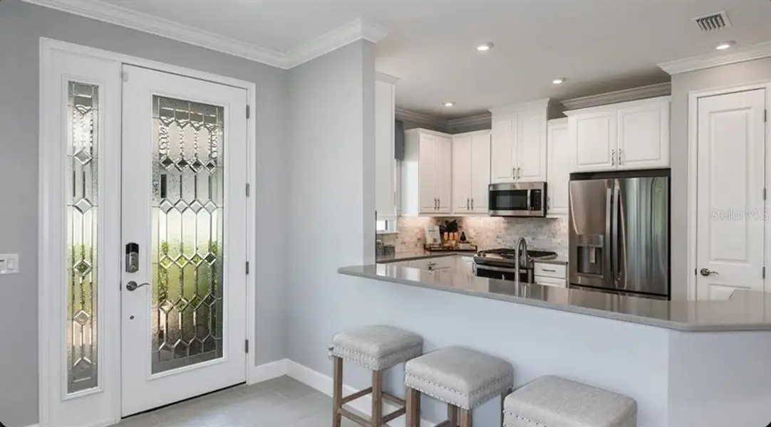 Furnished interior view inside a new home in Esplanade at Wellen Park, Englewood (Image 3).