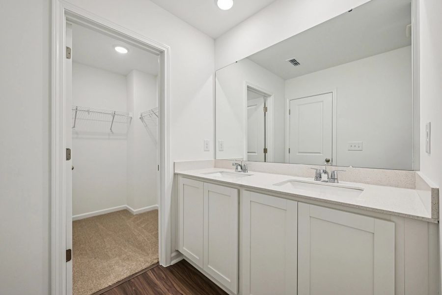 Primary Bath - Clean geometry and high-contrast finishes.