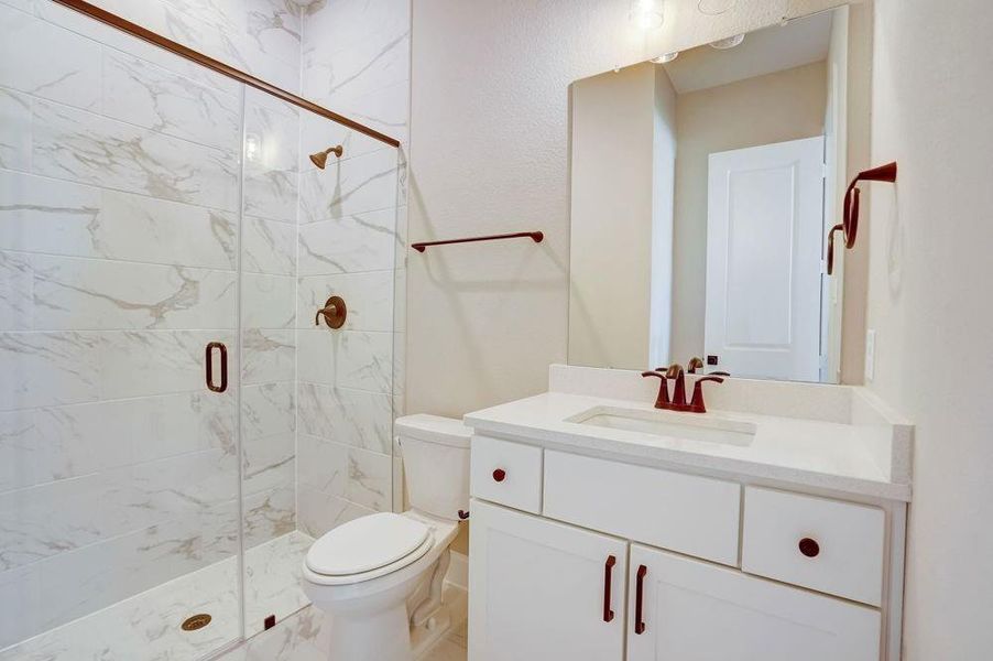 REPRESENTATIVE PHOTO: On-suite guest bath with walk in shower