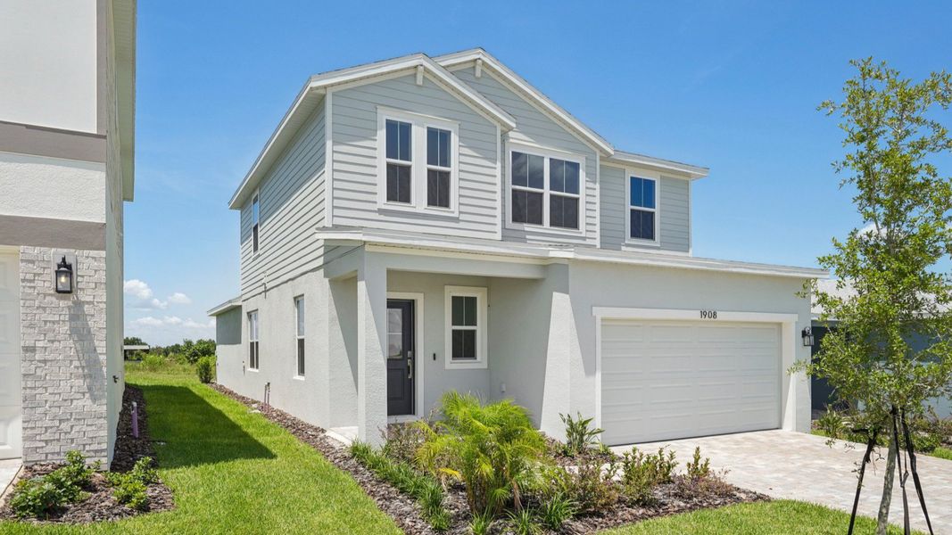 Representative exterior photo of a completed home built from the Jupiter by DRB Homes in Hamilton Bluff, Haines City, FL (Image 22).