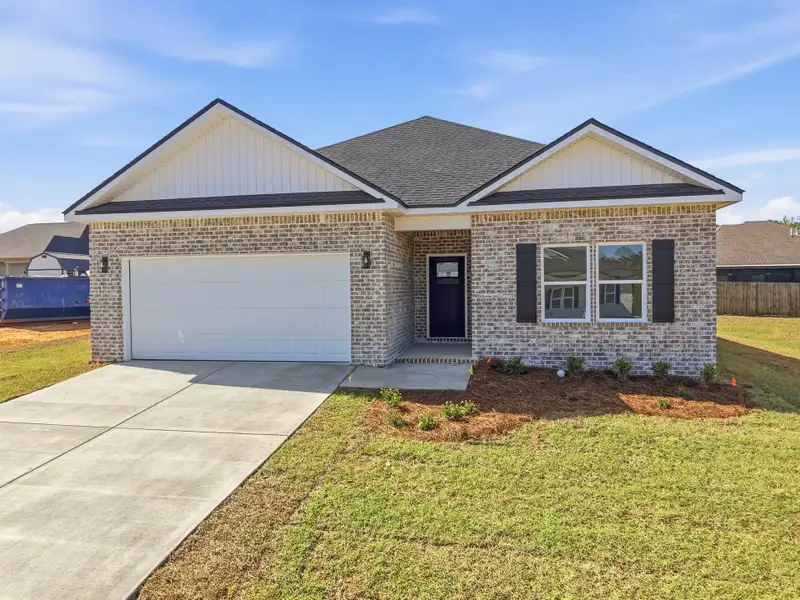 Front exterior of a new home in McCarthy Estates, Defuniak Springs, FL, highlighting curb appeal (Image 2). Front exterior of a new home in McCarthy Estates, Defuniak Springs, FL, highlighting curb appeal (Image 2).