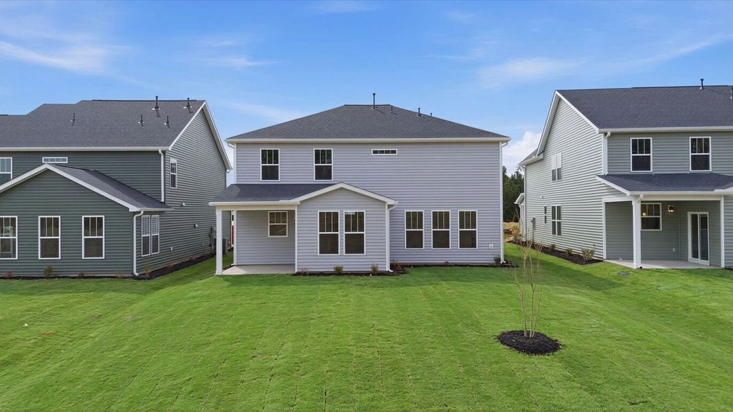 Warm and inviting outdoor living space with a covered rear porch and tasteful finishes located in Gray Court, SC