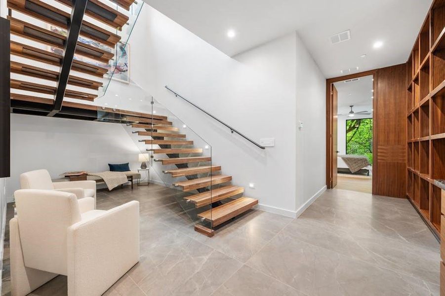 Floating stairs create this perfect reading corner