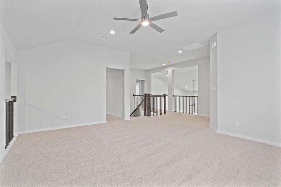 Another view of the game room looking out towards the staircase and entrance to the media room.