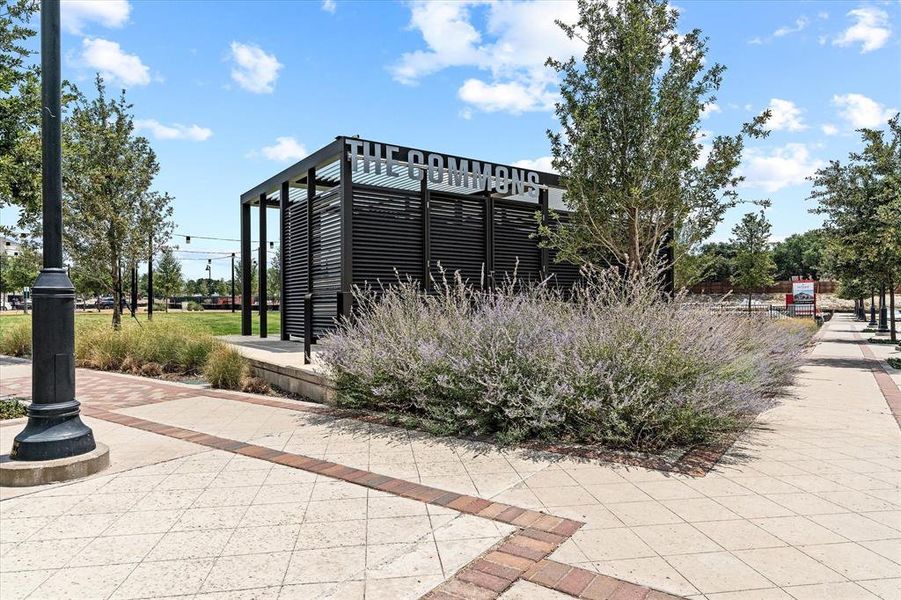 Outdoor amenity structure featuring a slatted design and prominent signage Outdoor amenity structure featuring a slatted design and prominent signage