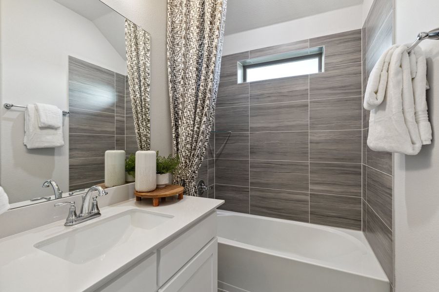 Bathroom in the Monet II home plan by Trophy Signature Homes – REPRESENTATIVE PHOTO