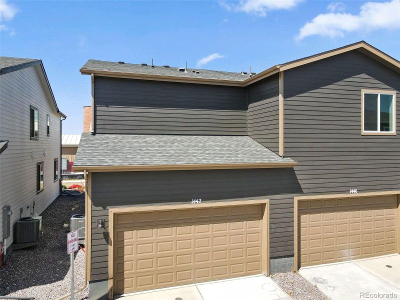 Front exterior of a new home in Spring Valley, Longmont, CO, highlighting curb appeal (Image 19).