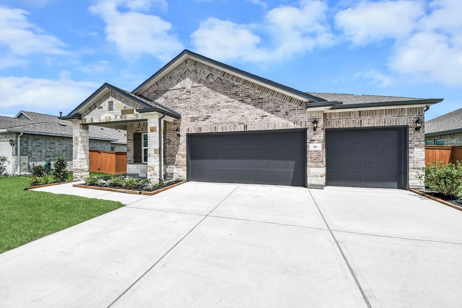 Front exterior of a new home in River Ranch Meadows, Dayton, TX, highlighting curb appeal (Image 2). Front exterior of a new home in River Ranch Meadows, Dayton, TX, highlighting curb appeal (Image 2).
