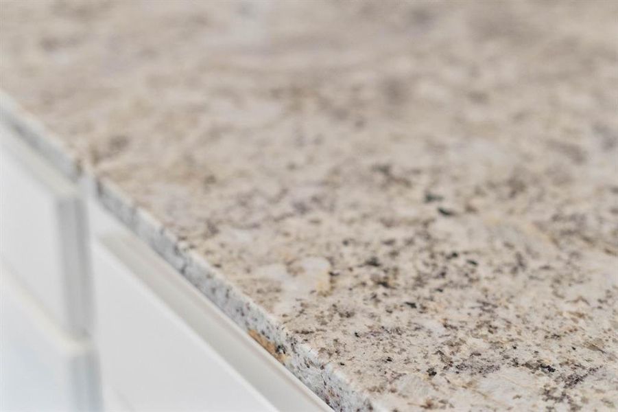 Nice granite countertops throughout the kitchen and bathrooms.