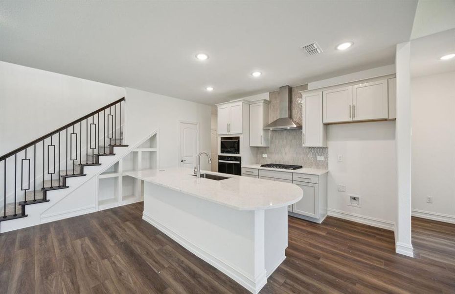 Spacious kitchen with oversized island *real home pictured