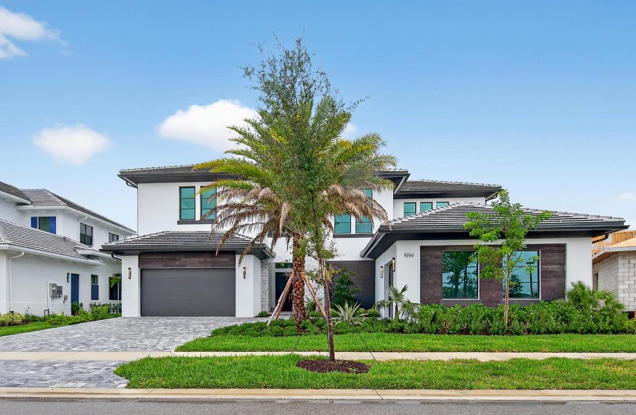 Front exterior of a new home in , Palm Beach Gardens, FL, highlighting curb appeal (Image 27).
