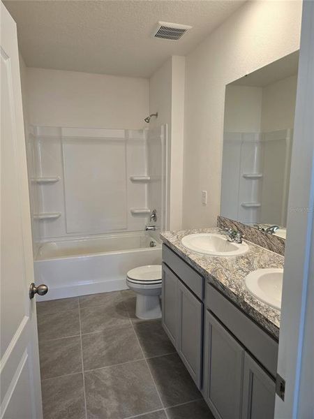 Furnished interior view inside a new home in Charles Cove Express, Davenport (Image 9).