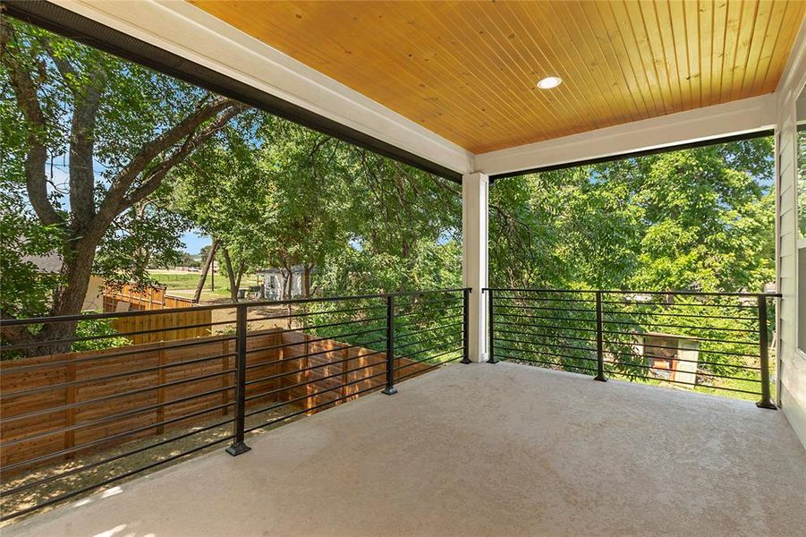 View of primary patio featuring a balcony