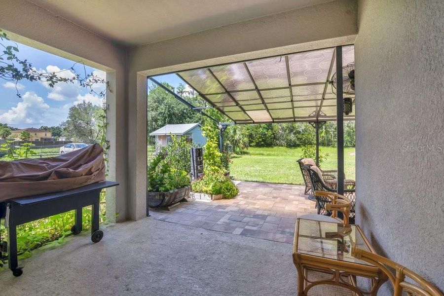 Exterior details and patio area of a home in Poinciana Enclave, Poinciana (Image 3).