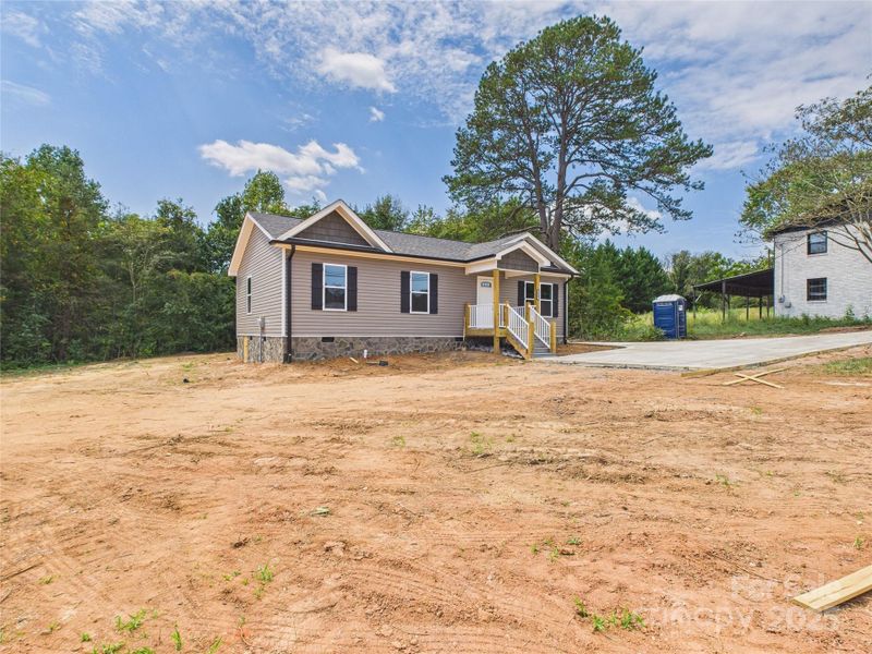 Front exterior of a new home in , Connelly Springs, NC, highlighting curb appeal (Image 19). Front exterior of a new home in , Connelly Springs, NC, highlighting curb appeal (Image 19).