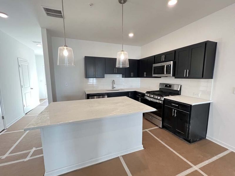 Kitchen featuring Industrial Collection Finishes Construction Progress