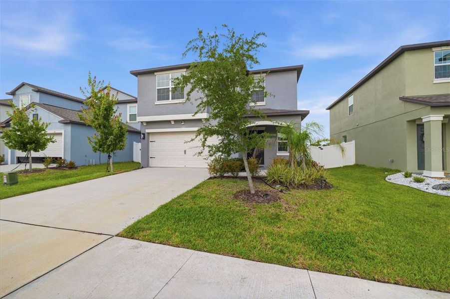 Front exterior of a new home in , Zephyrhills, FL, highlighting curb appeal (Image 26).