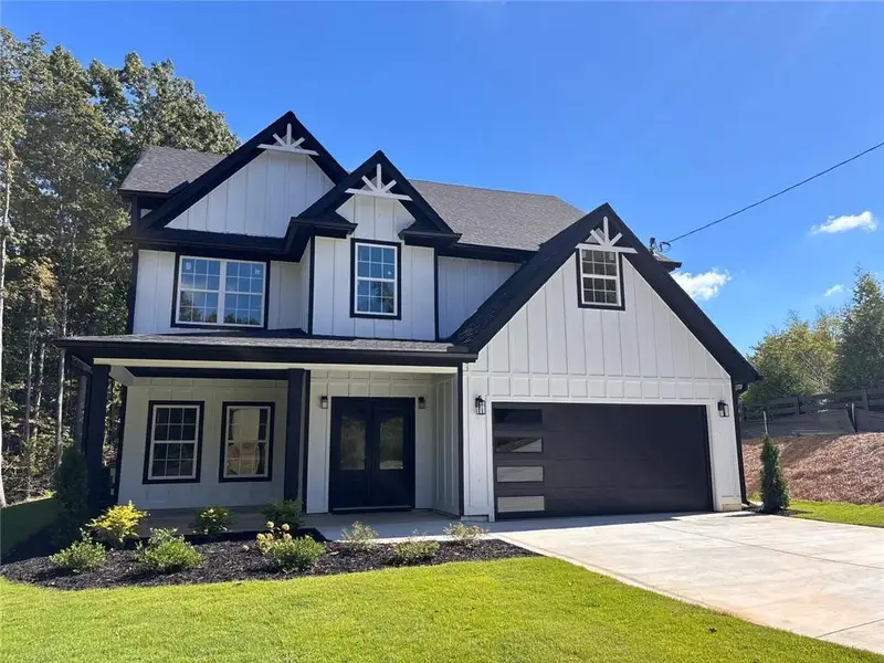 Front exterior of a new home in , Gainesville, GA, highlighting curb appeal (Image 2). Front exterior of a new home in , Gainesville, GA, highlighting curb appeal (Image 2).