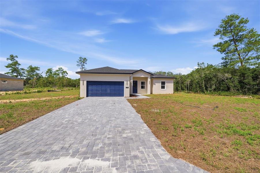 Front exterior of a new home in , Ocala, FL, highlighting curb appeal (Image 18). Front exterior of a new home in , Ocala, FL, highlighting curb appeal (Image 18).