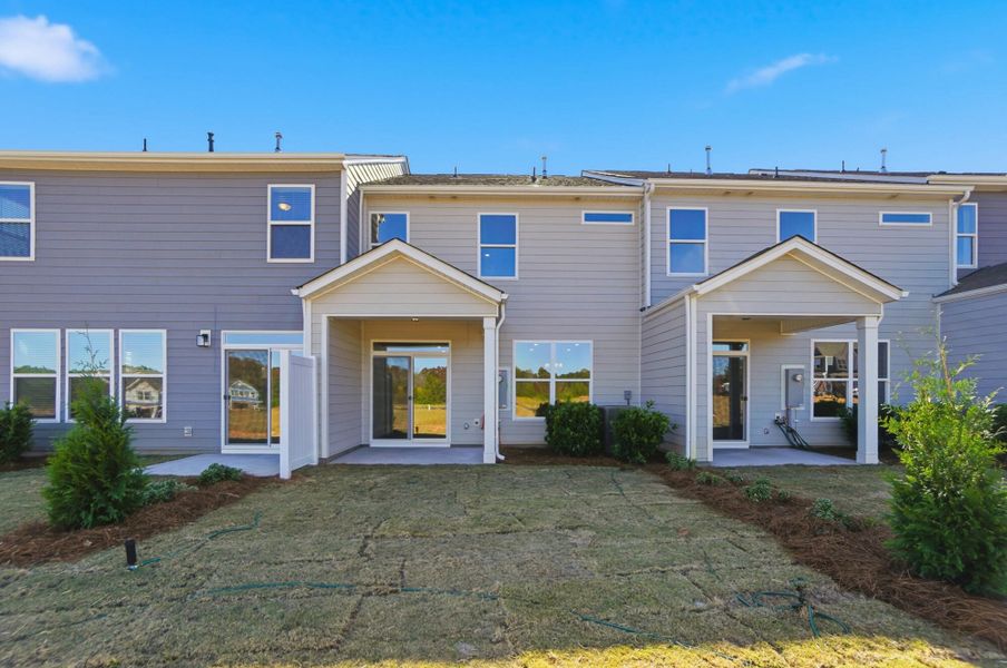 Exterior details and patio area of a home in Blythe Mill Townhomes, Waxhaw (Image 35).