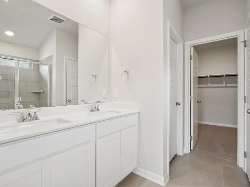 Primary suite bathroom in the Briscoe floorplan at a Meritage Homes community. Primary suite bathroom in the Briscoe floorplan at a Meritage Homes community.