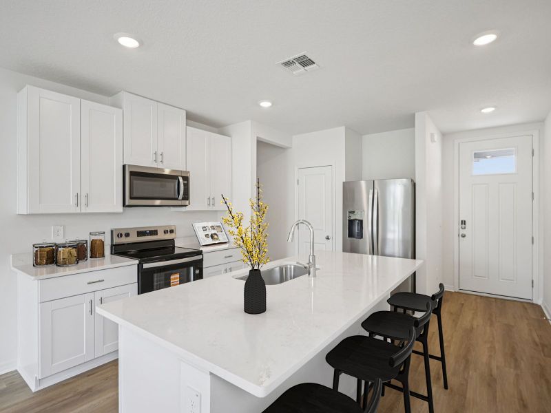 Furnished interior view inside a new home in The Grove at Stuart Crossing - Premier Series, Bartow (Image 4).