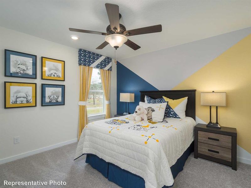 Carpeted bedroom with a ceiling fan, recessed lighting, and lofted ceiling