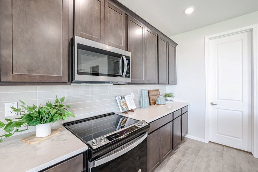 A kitchen with black appliances. A kitchen with black appliances.