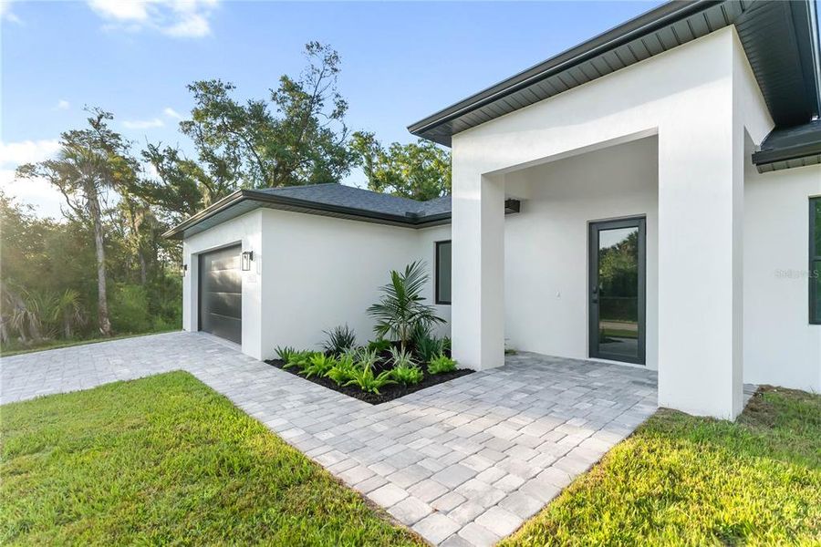 Front exterior of a new home in , Port Charlotte, FL, highlighting curb appeal (Image 27).