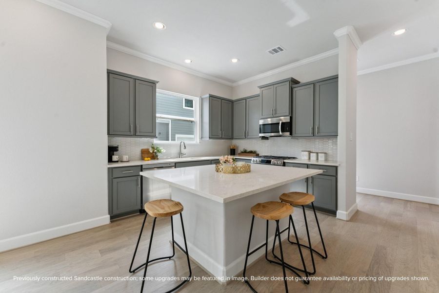 A Chef’s Dream Kitchen – Modern quartz countertops, stainless steel appliances, and a functional island make this kitchen the heart of the home.