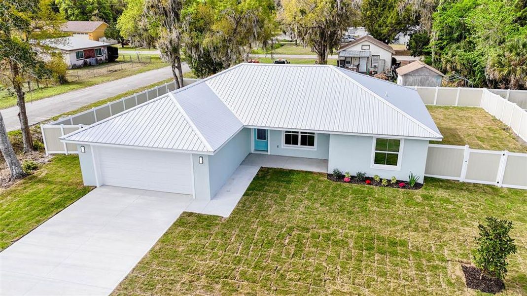 Front exterior of a new home in , Bunnell, FL, highlighting curb appeal (Image 26).
