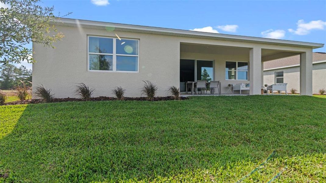 Exterior details and patio area of a home in Archers Mill, Ormond Beach (Image 26).