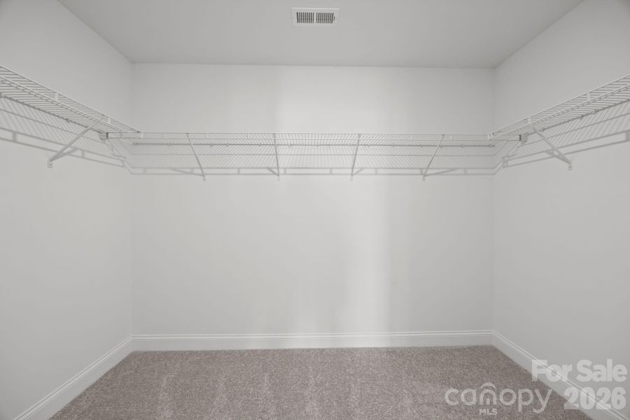 Primary ClosetPhotos are representative and may not reflect the exact home, finishes, or features.