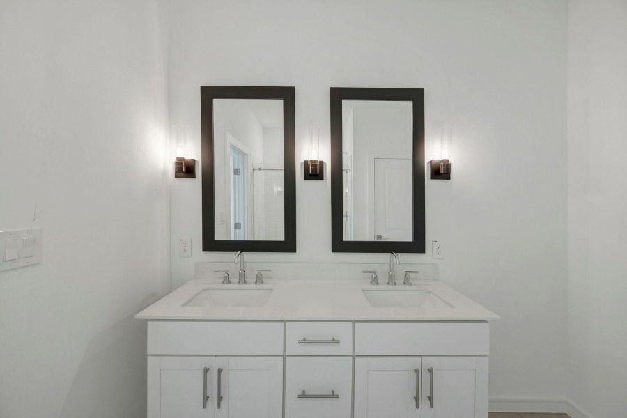 Luxurious primary bath with freestanding vanity Luxurious primary bath with freestanding vanity