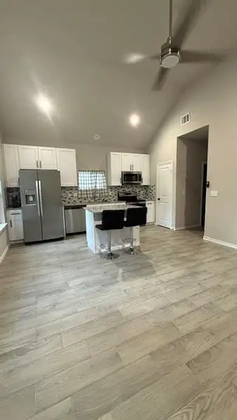 Living room and open kitchen.