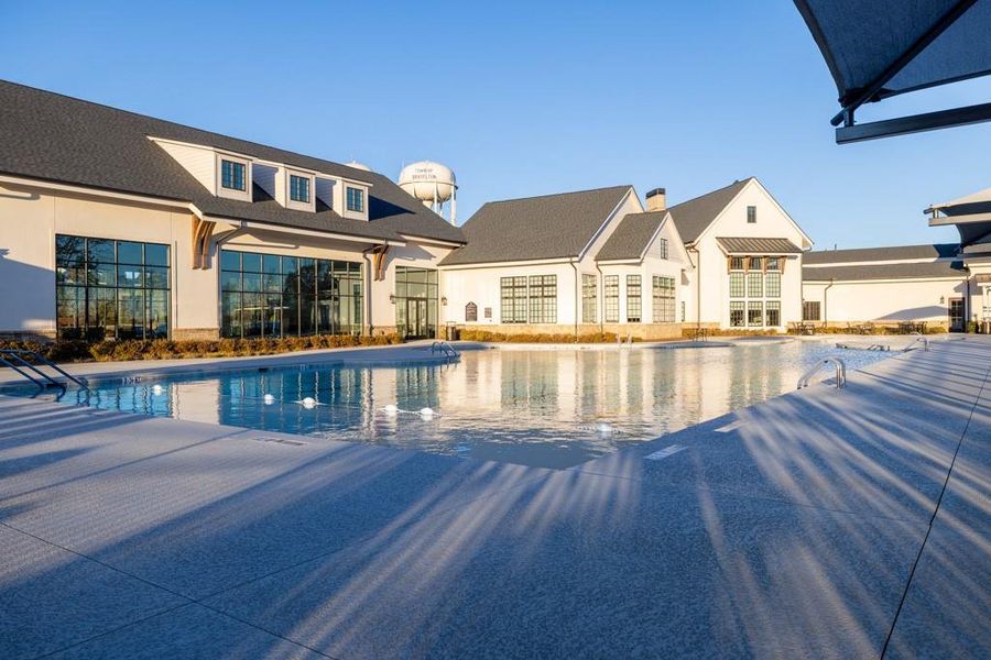 Front exterior of a new home in Del Webb Chateau Elan, Hoschton, GA, highlighting curb appeal (Image 15).