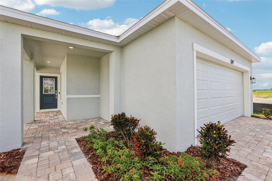Front exterior of a new home in Willowbrook North, Winter Haven, FL, highlighting curb appeal (Image 22). Front exterior of a new home in Willowbrook North, Winter Haven, FL, highlighting curb appeal (Image 22).
