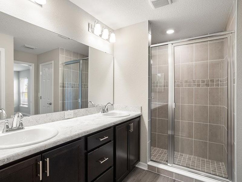 Your suite is complete with an en-suite bath and walk-in wardrobe.