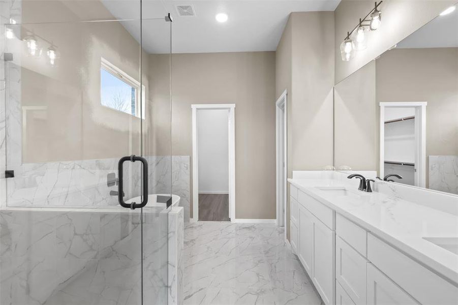 Bathroom with walk in shower and vanity