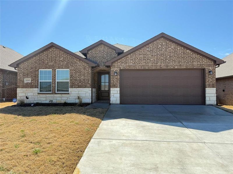 Front exterior of a new home in , Greenville, TX, highlighting curb appeal (Image 18).