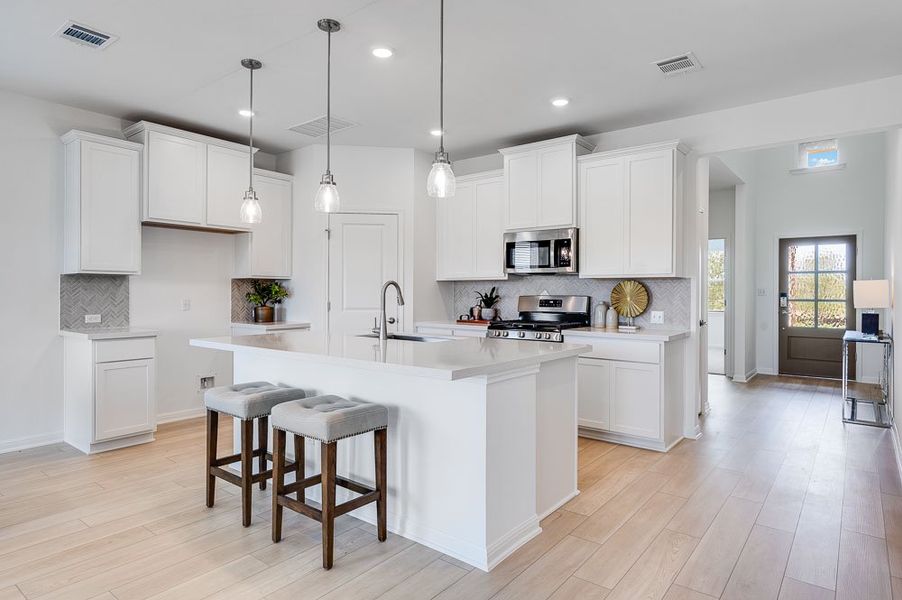 Representative furnished interior of a home built from the Sparrow by Taylor Morrison in Turner's Crossing 50s, Austin (Image 5).