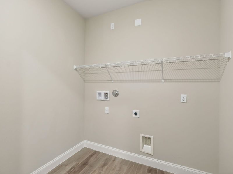 Laundry Room in the Coral floorplan at 6398 NW Sweetwood Dr