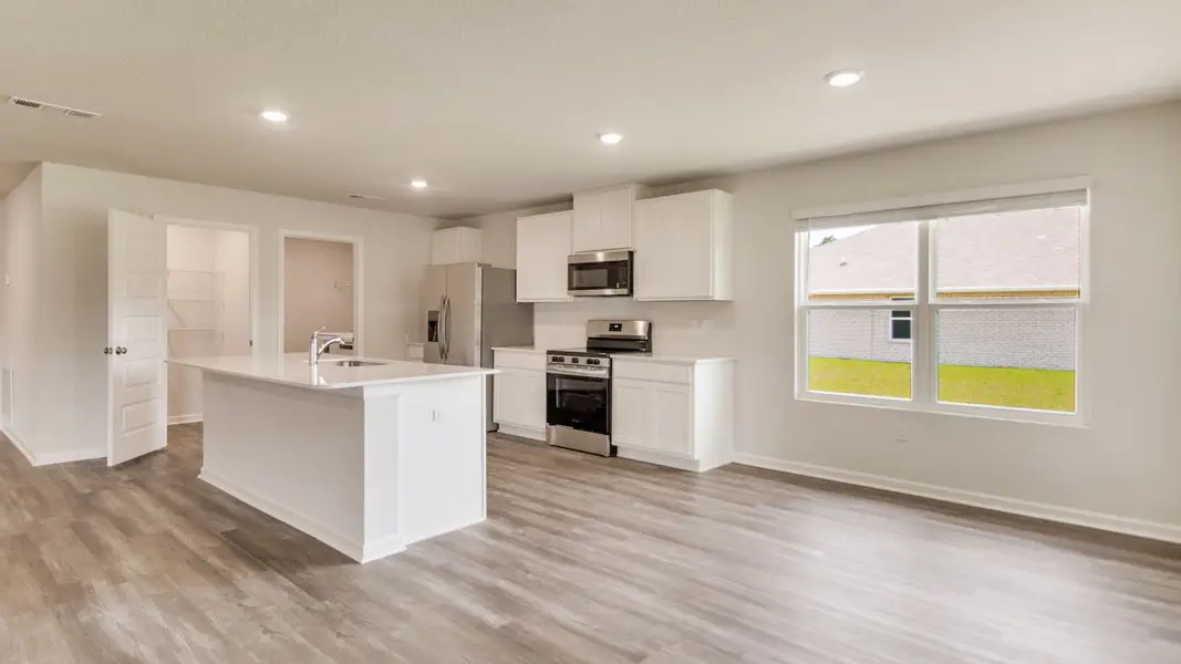 Furnished interior view inside a new home in The Enclave at Bar W Ranch, Baker (Image 3).