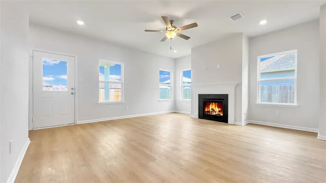 The Pearson- Family Room. Gas fireplace not included. Home under construction. Sample floor plan photo used for illustrative purposes only. Upgrades, selections options, windows and colors may vary.
