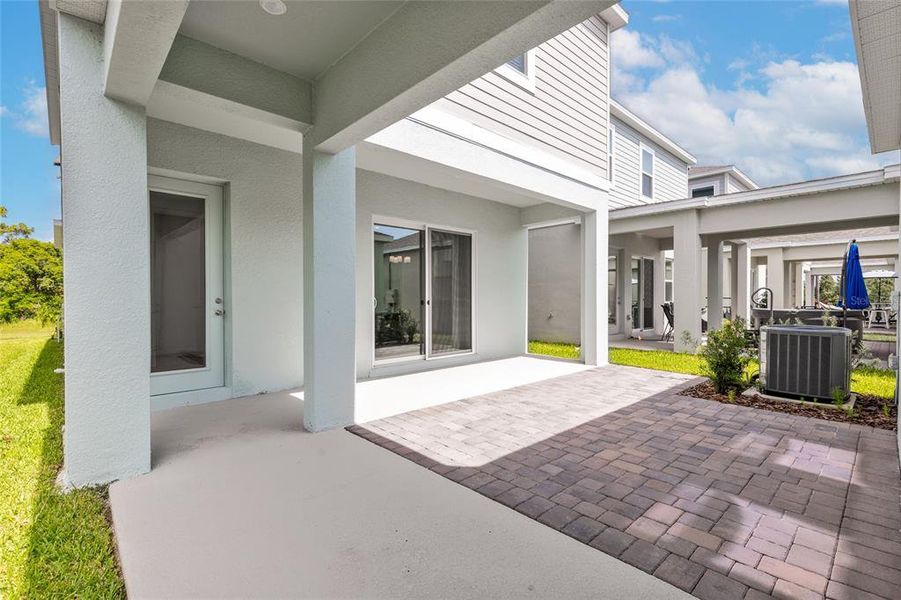Exterior details and patio area of a home in Serenade at Ovation, Winter Garden (Image 4). Exterior details and patio area of a home in Serenade at Ovation, Winter Garden (Image 4).