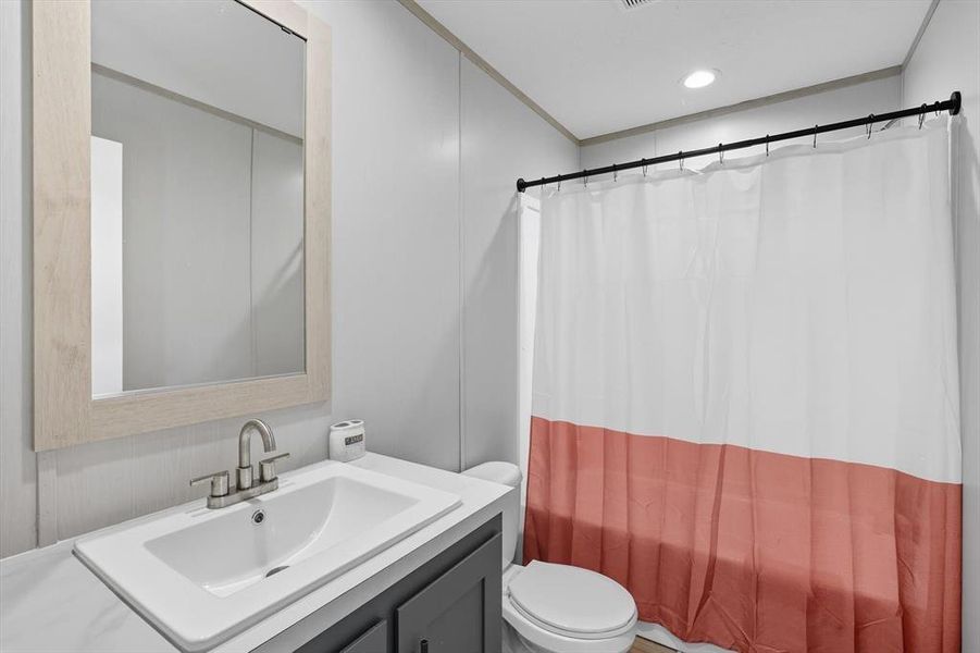 Full bathroom with vanity and recessed lighting Full bathroom with vanity and recessed lighting