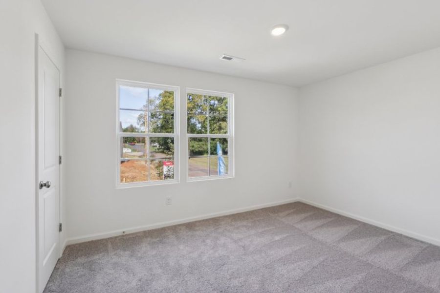 A room with a window and a door.